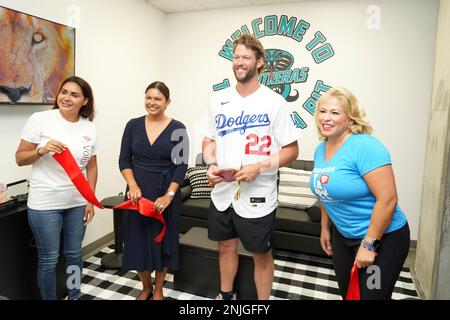 Los Angeles Dodgers pitcher Clayton Kershaw (22) poses with Miguel  Contreras Learning Complex high school students