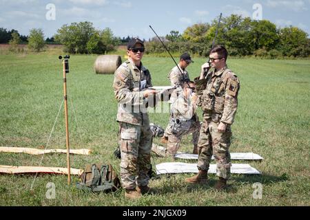 U.S. Army Soldiers utilize Multiband Inter/Intra Team Radios as part of the U.S. Army Pathfinder course at Camp Dodge in Johnston, Iowa, on Sept. 7, 2022. Army Pathfinders are trained to provide navigational aid and advisory services to military aircraft in areas designated by supported unit commanders. During the Pathfinder course, students are instructed in aircraft orientation, aero-medical evacuation, close combat assault, ground to air communication procedures, control center operations, all three phases of a sling load operation, helicopter landing zone and pick up zone operations, and d Stock Photo