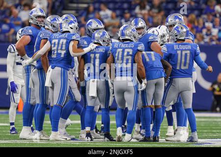 Detroit Lions offense huddles against Indianapolis Colts during an