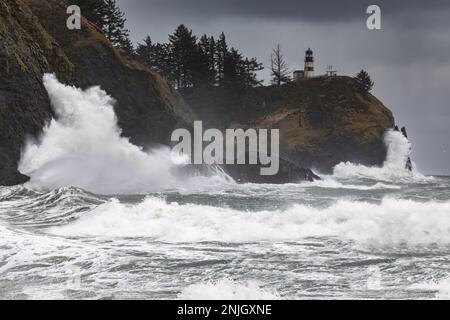WA23053-00...WASHINGTON - Stormy day along the Pacific Coast near the entrance to the Columbia River in a cove below Cape Disappointment Lighthouse. Stock Photo