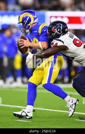 Los Angeles Rams quarterback John Wolford is tackled by Houston