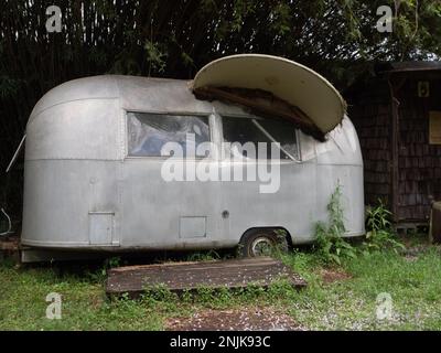 Exterior of a vintage Airstream trailer on display at the Abita Mystery House or UCM Museum in Abita Springs, Louisiana. Stock Photo