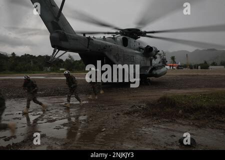 NAVAL BASE HERA, TIMOR-LESTE (Feb. 12, 2023) – U.S. Marines assigned to Battalion Landing Team 2/4, 13th Marine Expeditionary Unit, and Timor-Leste Corpo De Fuzileiros board a CH-53E Super Stallion piloted by Marines assigned to Marine Medium Tiltrotor Squadron (VMM) 362 (Rein.), 13th MEU, during Cooperation Afloat Readiness and Training/Marine Exercise Timor-Leste, Feb. 12. CARAT/MAREX Timor-Leste is a bilateral exercise between Timor-Leste and the United States designed to promote regional security cooperation, maintain and strengthen maritime partnerships, and enhance maritime interoperabil Stock Photo