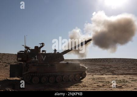 Israeli Defense Force 411 Keren Mobile Artillery Unit fires an M109 howitzer during exercise Intrepid Maven 23.2, Feb. 20, 2023. Intrepid Maven is a bilateral exercise between USMARCENT and the IDF designed to improve interoperability, strengthen partner-nation relationships in the U.S. Central Command area of operations and improve both individual and bilateral unit readiness. (U.S. Marine Corps photo by Cpl. Kolby Leger) Stock Photo