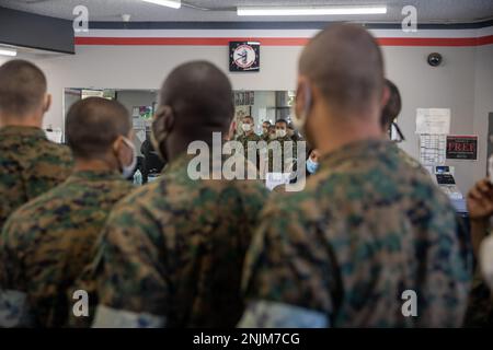 U.S. Marine Corps recruits from Echo Company, 2nd Recruit Training Battalion, stand in line for haircuts at Marine Corps Recruit Depot San Diego, Aug. 8, 2022. Recruits received haircuts weekly to ensure uniformity. Stock Photo
