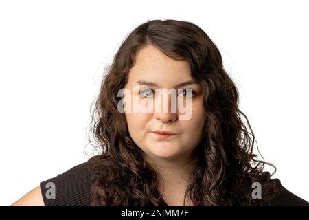 Portrait of young woman who is has a questioning look, on white background Stock Photo