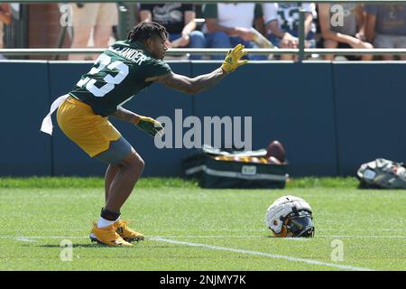 ASHWAUBENON, WI - JULY 27: Green Bay Packers linebacker Isaiah McDuffie  (58) bikes with a fan during Green Bay Packers training camp at Ray  Nitschke Field on July 27, 2022 in Ashwaubanon