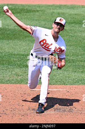 BALTIMORE, MD - JULY 04: Baltimore Orioles starting pitcher Dean Kremer  (64) turns and throws to first during a MLB game between the Baltimore  Orioles and the Texas Rangers, on July 04