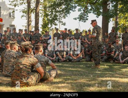 U.S. Marine Corps Gen. David H. Berger, 38th Commandant of the Marine Corps, speaks to the Marines and Sailors of U.S. Marine Corps Forces Europe and Africa at U.S. Army Garrison Panzer Kaserne in Boeblingen, Germany, Aug. 9, 2022. Those in attendance were given the opportunity to ask questions and bring up discussion points with Gen. Berger during the visit. Stock Photo