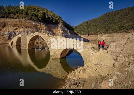 Querós medieval bridge, in the Susqueda reservoir, submerged after the construction of the reservoir and it can be seen in periods of strong drought Stock Photo