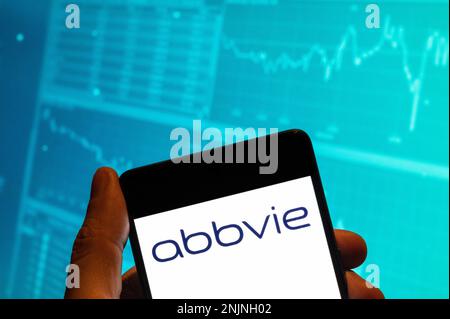 China. 15th Feb, 2023. In this photo illustration, the American biopharmaceutical company Abbvie logo is seen displayed on a smartphone with an economic stock exchange index graph in the background. (Photo by Budrul Chukrut/SOPA Images/Sipa USA) Credit: Sipa USA/Alamy Live News Stock Photo