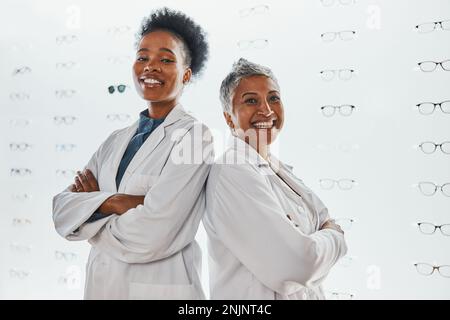 Optometry, healthcare and portrait of optometrists in a clinic after optic consultation or eye test. Leadership, ophthalmology and team of women Stock Photo