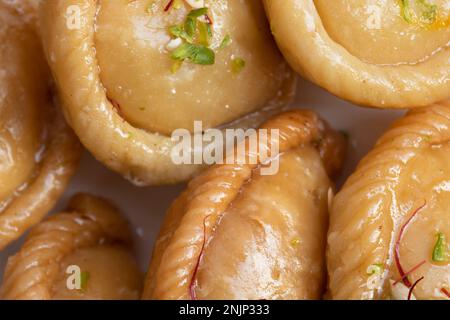 Chandrakala And Gujiya Mithai Also Called Suryakala, Gujia, Pirukiya, Pirukia, Pedakiya, Karanji, Basundi, Gughra Is Made Of Suji Ghee, Mawa Khoya Cha Stock Photo