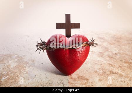 Sacred Heart of Jesus, surrounded by a crown of thorns and with wooden ...