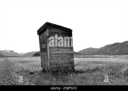 black and white photograph of rural mailbox on a lone back country road. Stock Photo