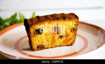 The fruitcake is a cake made with candied or chopped fresh fruit, nuts and spices, and optionally soaked in liquor. Stock Photo