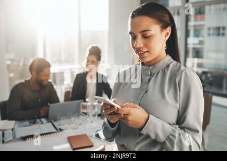 Business woman, phone text and teamwork meeting with a female employee on a mobile app. Office, corporate team and online chat of a financial Stock Photo