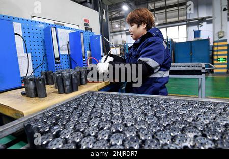ZHANGJIAKOU, CHINA - FEBRUARY 23, 2023 - A worker works on a drilling tool  production line at Xuanhua Economic Development Zone in Zhangjiakou, Hebei  province, China, Feb 23, 2023. At present, there