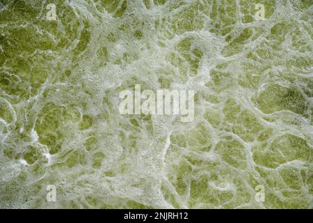 Churning water. Turbulence on the water surface. Troubled water as a background. Stock Photo