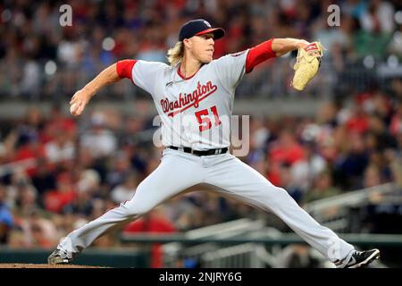 ATLANTA, GA - JULY 08: Washington Nationals relief pitcher Jordan Weems  (51) prepares to deliver a pitch during the Friday evening MLB game between  the Washington Nationals and the Atlanta Braves on