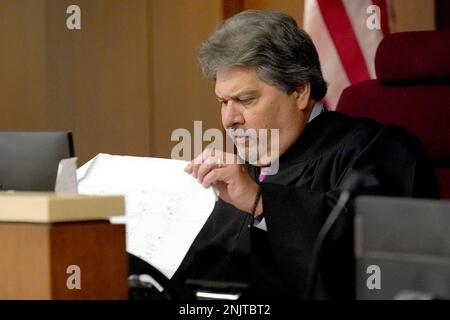 Lake County Judge Theodore Potkonjak, left, presides over the initial  appearance of Robert E. Crimo III at the county courthouse Wednesday, July  6, 2022, in Waukegan, Ill. Crimo is accused of killing