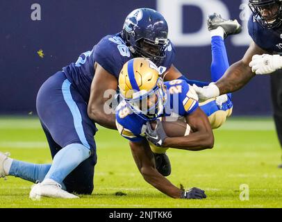 Winnipeg Blue Bombers' Greg McCrae (29) and Brady Oliveira (20