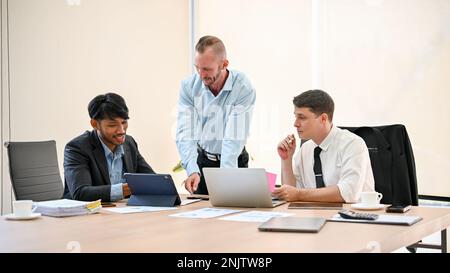 Group of diverse businesspeople are having a financial meeting in the meeting room, discussing a financial investment plan, analyzing financial data, Stock Photo