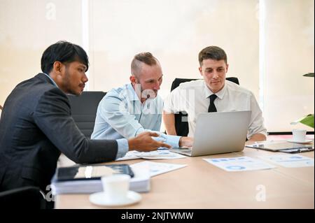A professional financial team is in the meeting to discuss and plan their business's financial investment and analyze the business's current financial Stock Photo