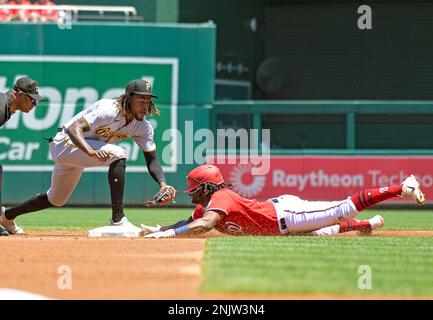 Chicago Cubs third baseman David Bote, left, can't handle the throw from  catcher P.J. Higgins as Pittsburgh Pirates' Oneil Cruz (15) steals second  during the first inning of a baseball game in