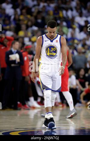 Stephen Curry of the Golden State Warriors walks on the court