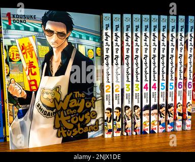 The Way of the Husband Manga series books on a shelf. Kousuke Oono Stock Photo