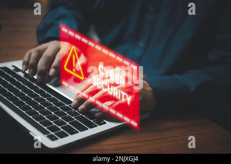 Businessman programmer, developer using laptop computer with triangle caution warning sign. system hacked on computer network cybersecurity vulnerabil Stock Photo