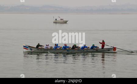 A traditional Cantabrian trainera racing rowing boat training in the bay of Santander Cantabria Spain Stock Photo