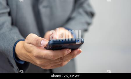 man using mobile smart phone.Digital technology communications concept. Stock Photo