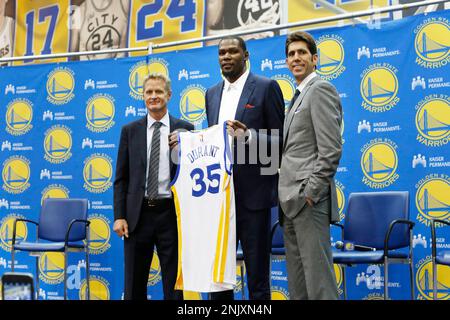 Kevin Durant speaks (second from right) sits alongside Steve Kerr (second  from left), Warriors head coach and Bob Myers, (right) Warriors general  manager, as he speaks during the introductory press conference for