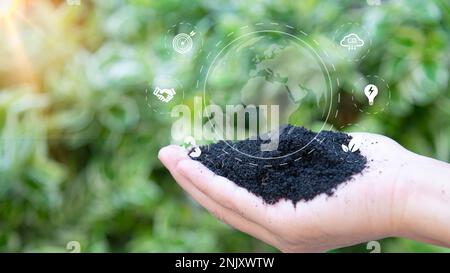 hand with environmental icons CO2 emission reduction icons global warming sustainable development and green business renewable energy clean and friend Stock Photo