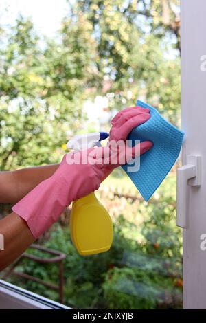 Naked woman cleaning windows Stock Photo - Alamy