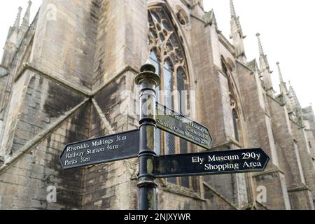 Shallow focus of wrought iron public direction signs in the famous city. Part of the cathedral is seen in the background. Stock Photo