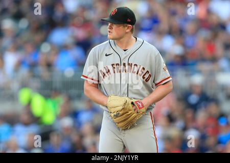 ATLANTA, GA - JUNE 20: Former Brave Joc Pederson #23 of the San Francisco  Giants and his daughter Poppy prior to the Monday evening MLB game between  the Atlanta Braves and the