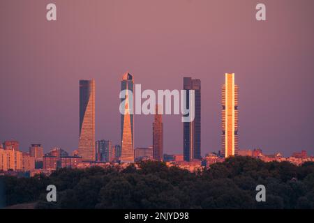 Picturesque cityscape view of contemporary megapolis district under a sunset sky in Madrid Stock Photo