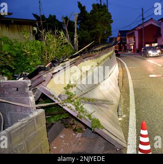 A photo shows a long wall collapsing due to a strong earthquake in Suzu ...