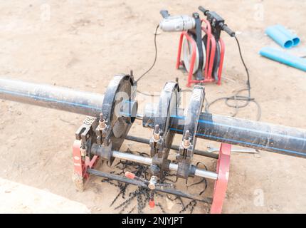 Water supply project at working for welding the connecting of HDPE pipe in construction site. Stock Photo