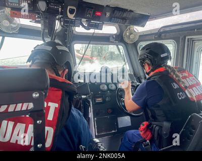 Coast Guard Station Islamorada coxswain Petty Officer 2nd Class Amanda Matos trains on tactical boat driving maneuvers, Aug. 10, 2022, Islamorada, Florida. Coast Guard Station Islamorada is a multi-mission unit ready to respond to search and rescue and law enforcement missions. Stock Photo