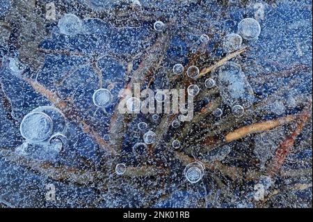 Closeup Frozen Water With Bubbles Of Air Catched Under The Ice Stock Photo