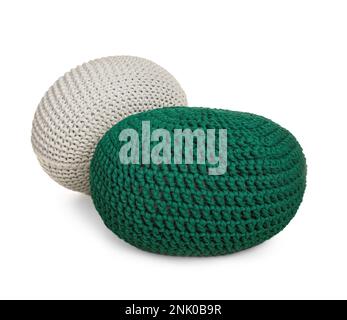 Different stylish knitted poufs on white background Stock Photo