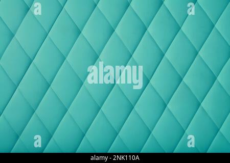 Background texture of teal blue leather soft tufted furniture or wall panel upholstery with deep diamond pattern, close up Stock Photo