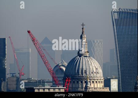 London's St Paul's Cathedral and Walkie Talkie stand out clearly while Canary Wharf is barely visible in the mist Stock Photo