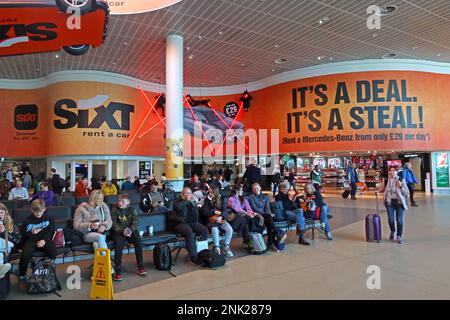 Sixt vehicle lease / rental promotion at Manchester Airport, Its a deal, Its a steal - channelling Mission Impossible Stock Photo