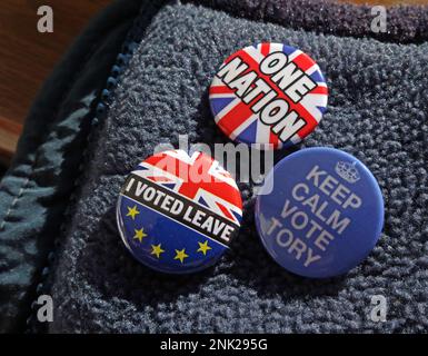 Badges on a Tory voter jacket - Will Brexit Leavers keep calm and vote Tory for one nation ? Stock Photo