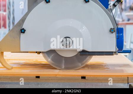 Automatic cnc bridge saw - router profiling system cutting artificial stone Stock Photo